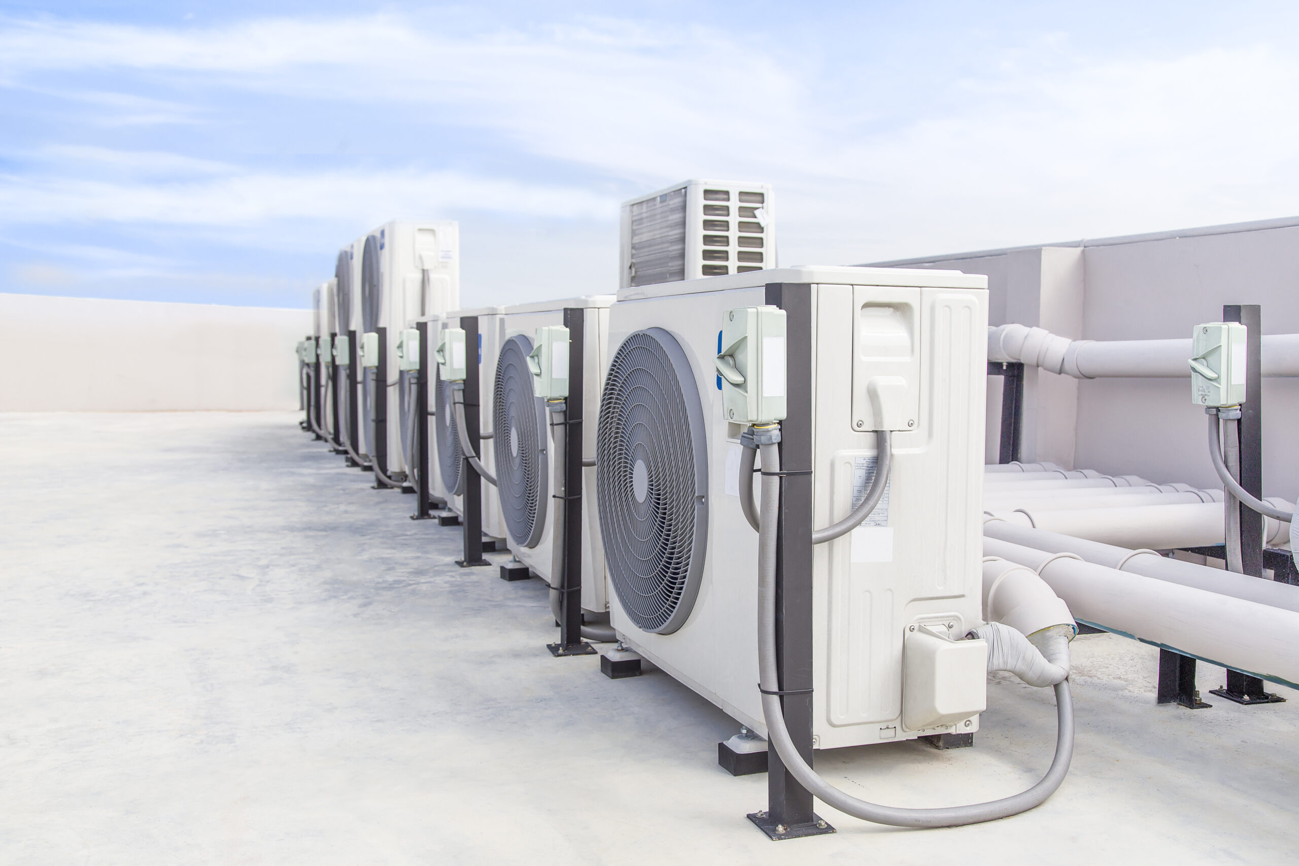 air-conditioning-hvac-roof-industrial-building-with-blue-sky-clouds