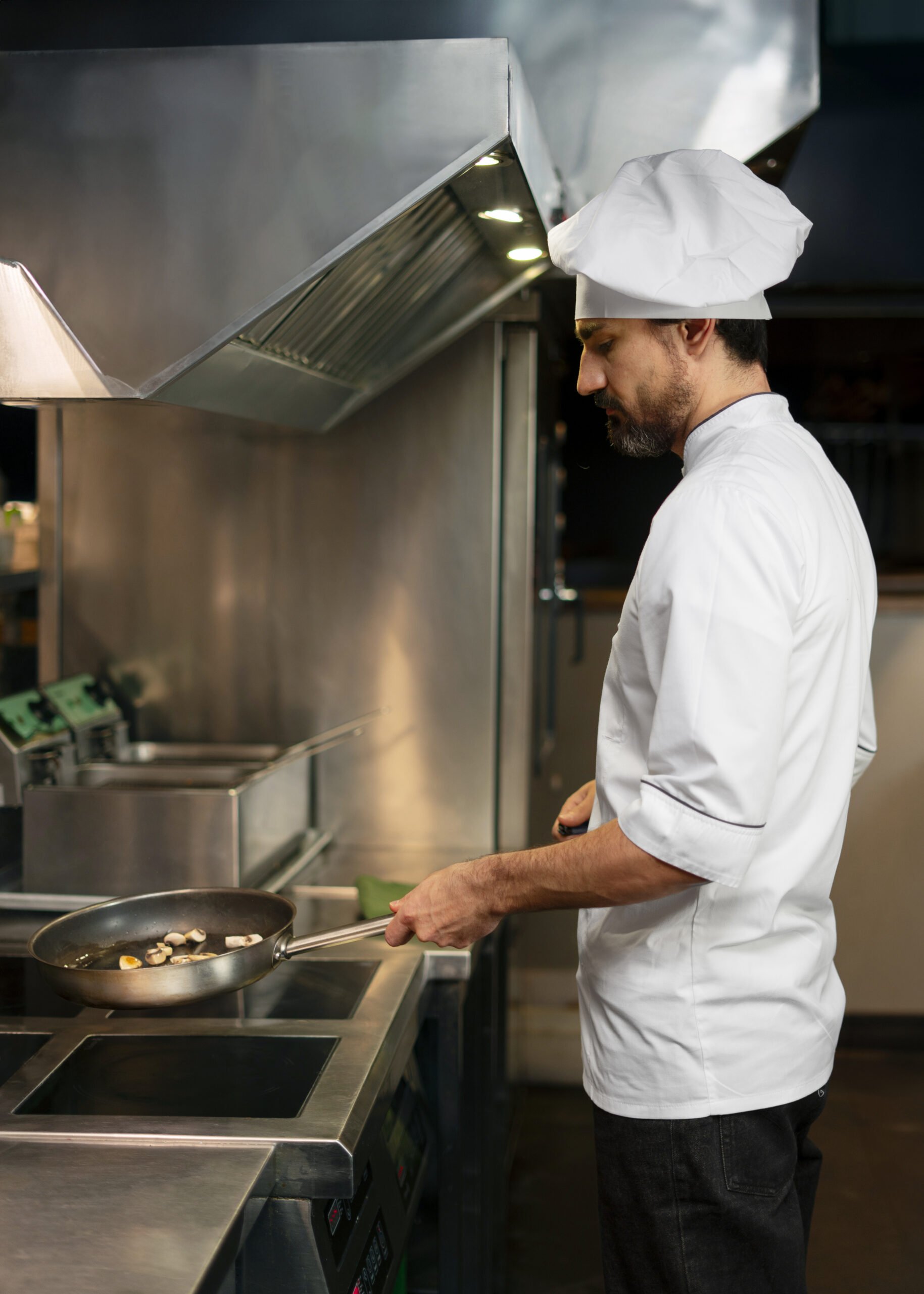 chef-cooking-kitchen-while-wearing-professional-attire